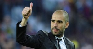FC Barcelona's coach Josep Guardiola gives his thumbs up after winning the Spanish La Liga league title at the end of the Spanish La Liga soccer match against Valladolid at the Camp Nou stadium in Barcelona, Spain, Sunday, May 16 , 2010. (AP Photo/Manu Fernandez)